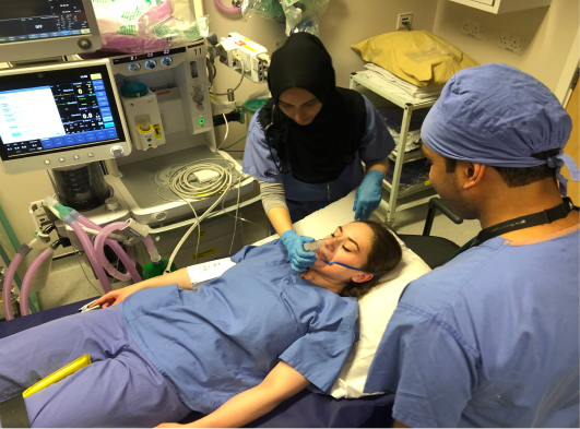 Student doing procedure under medic supervision